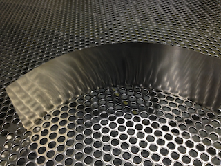 Roller-embossing shim, backside